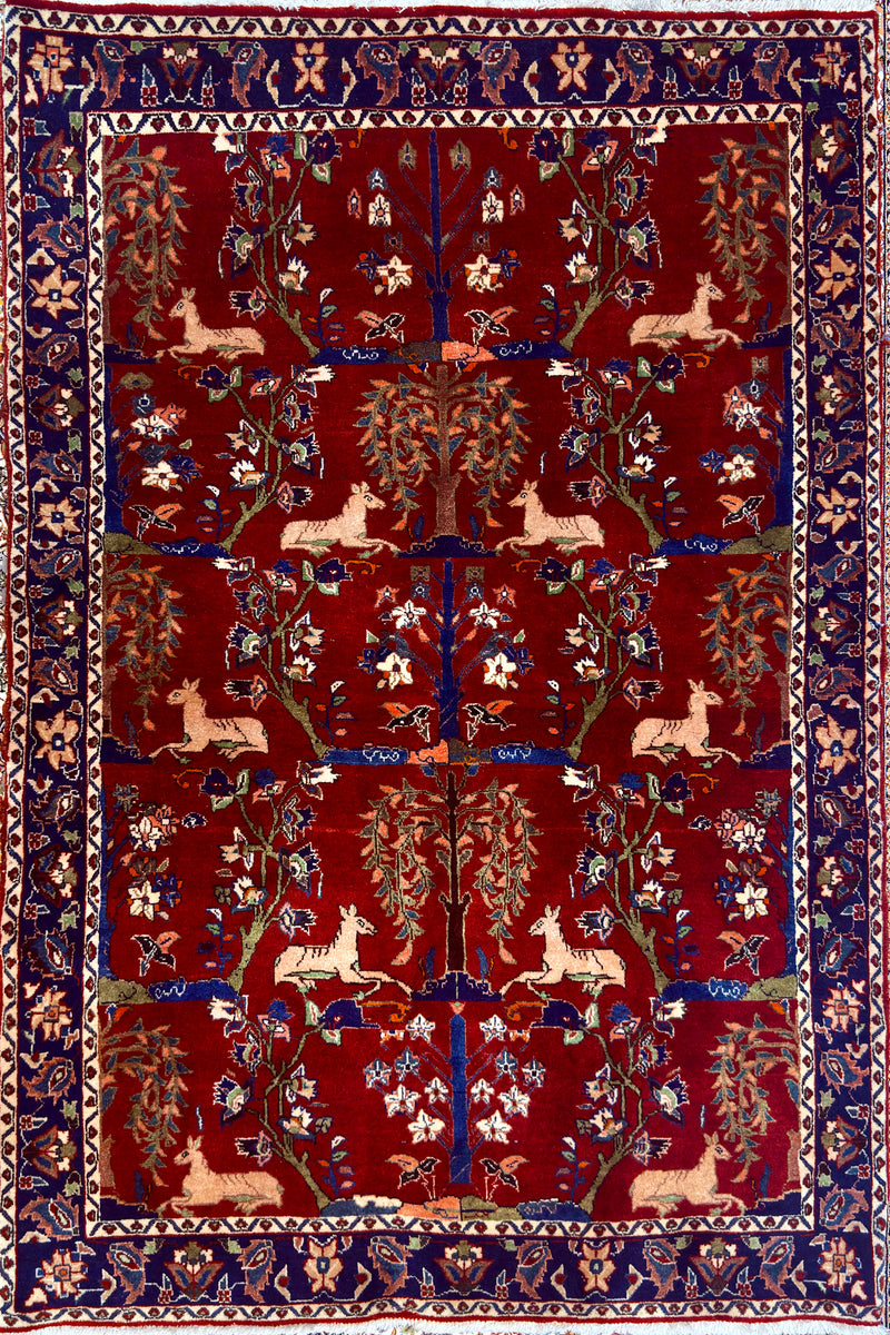 Antique Bakhtiari Zaronim carpet with intricate animal and floral designs on a red background
