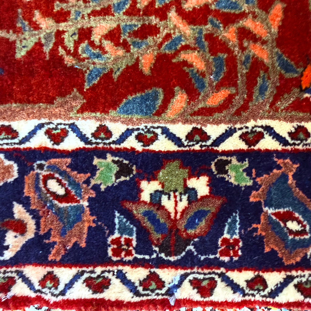 Close-up of a colorful patterned rug with intricate designs.