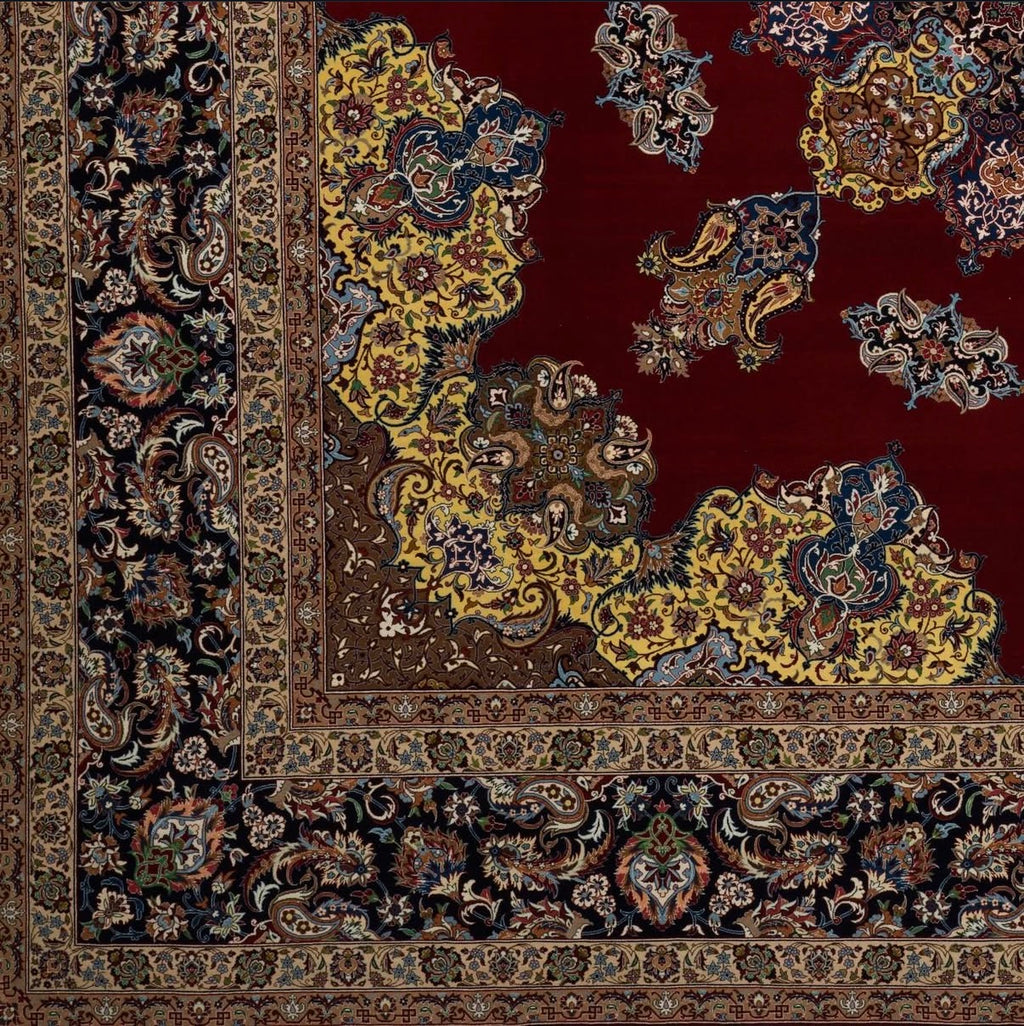 Close-up of a patterned rug with intricate designs on a red background