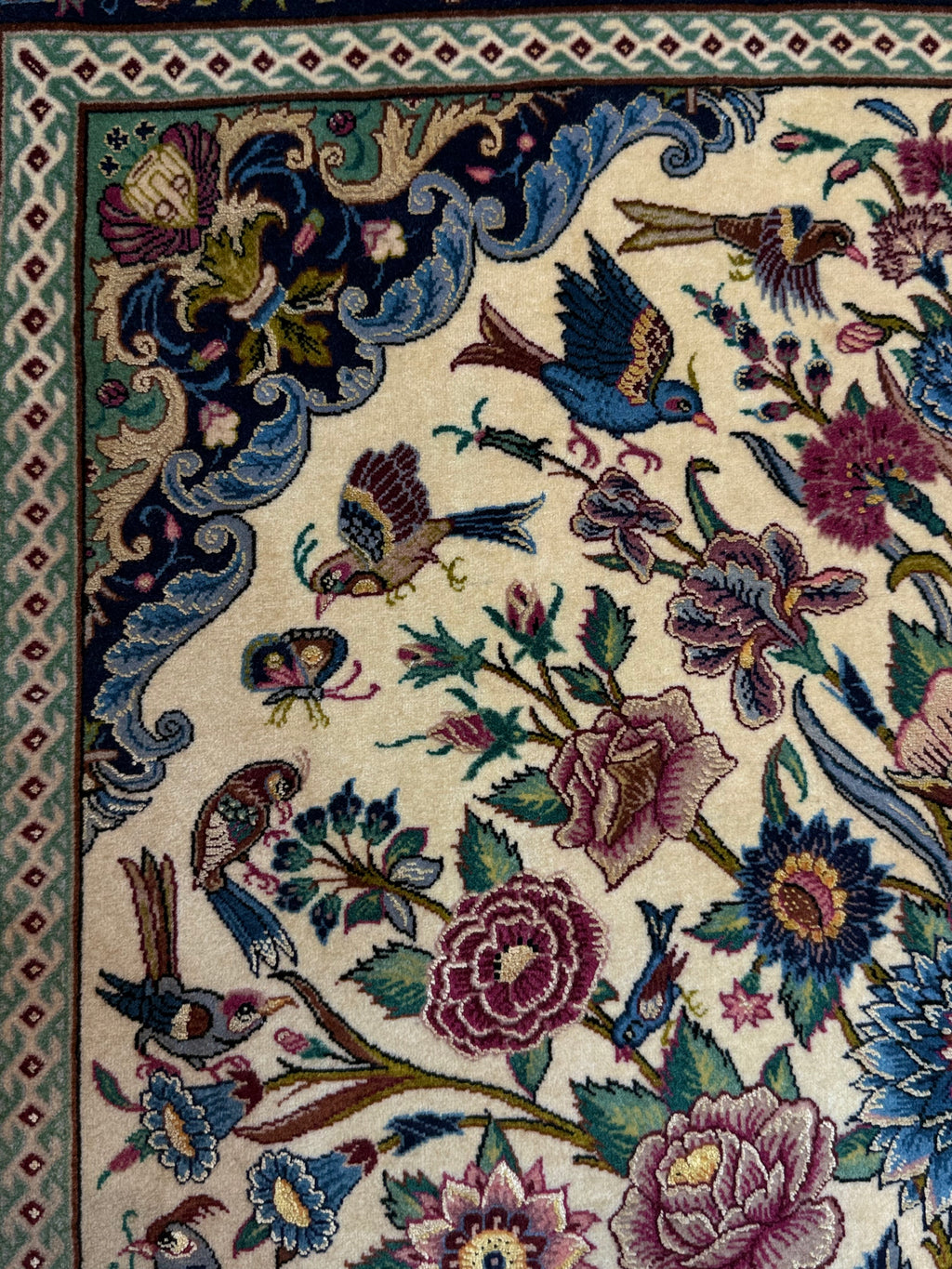 Decorative rug with intricate floral and bird patterns