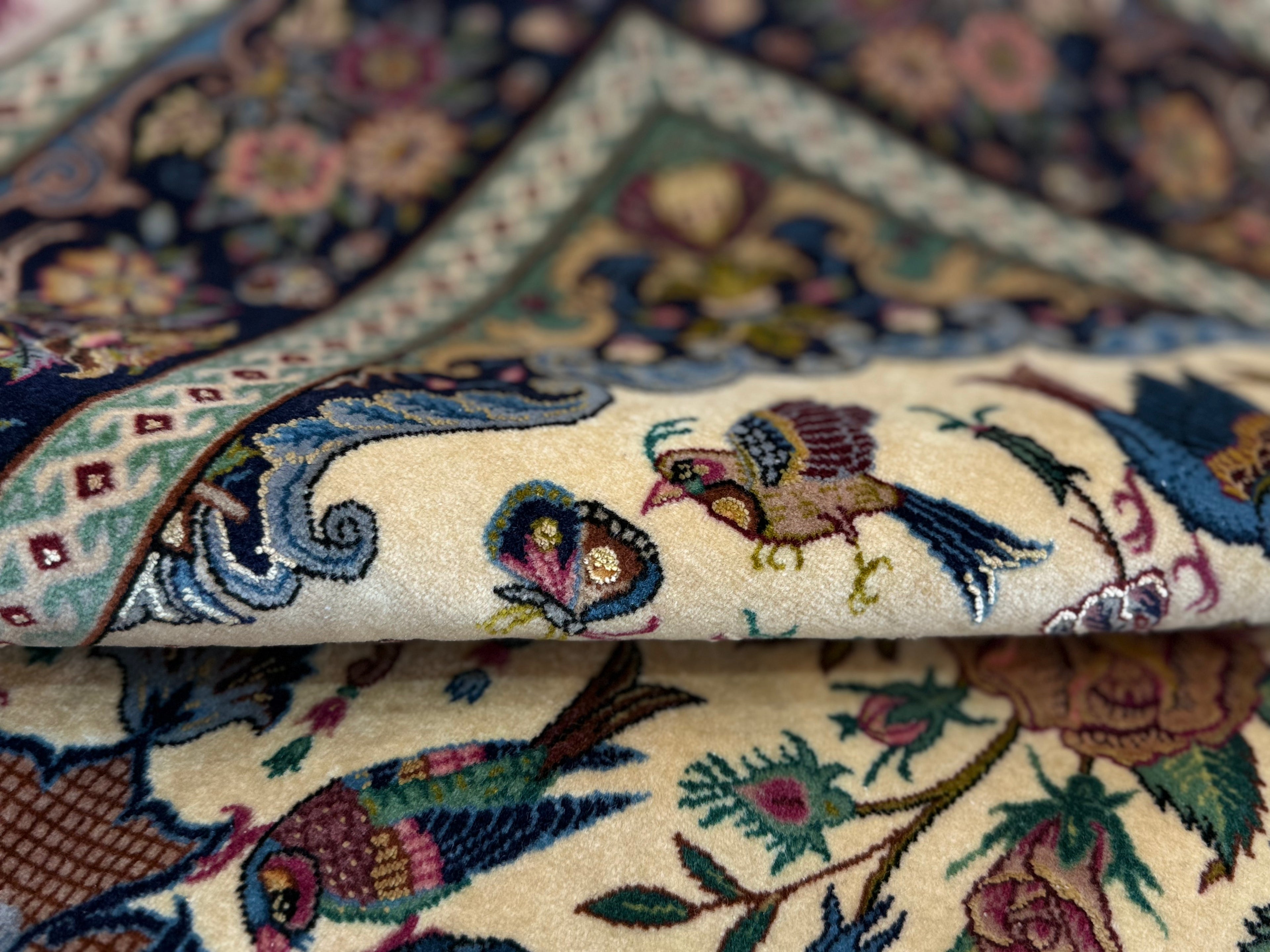 Close-up of a patterned rug with intricate designs and colors.