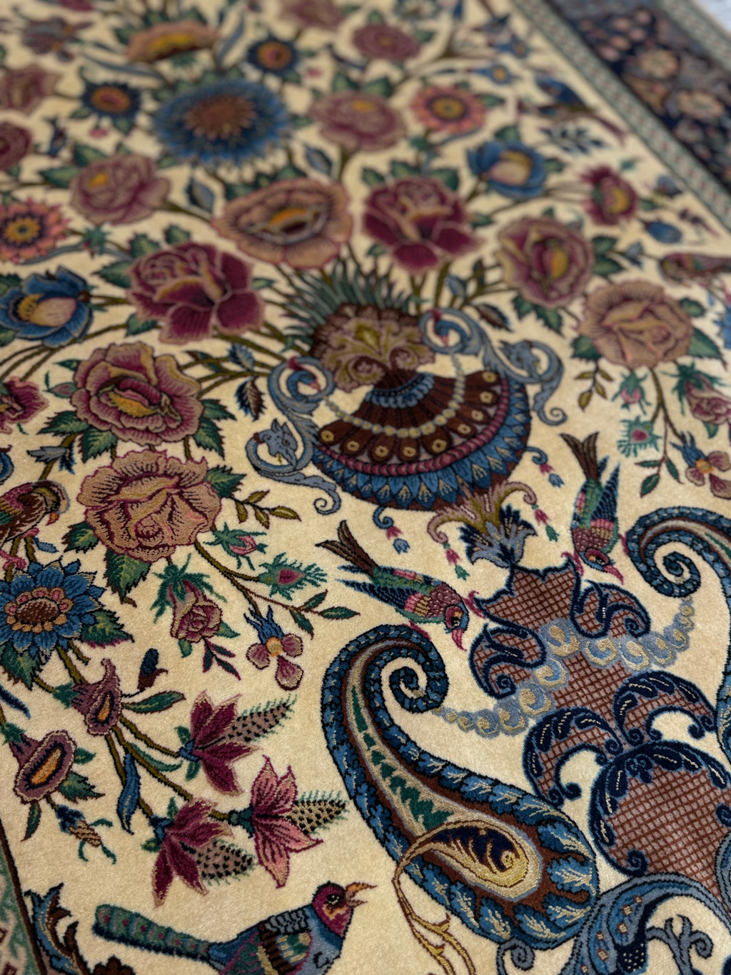 Close-up of a intricately designed floral and paisley patterned rug.
