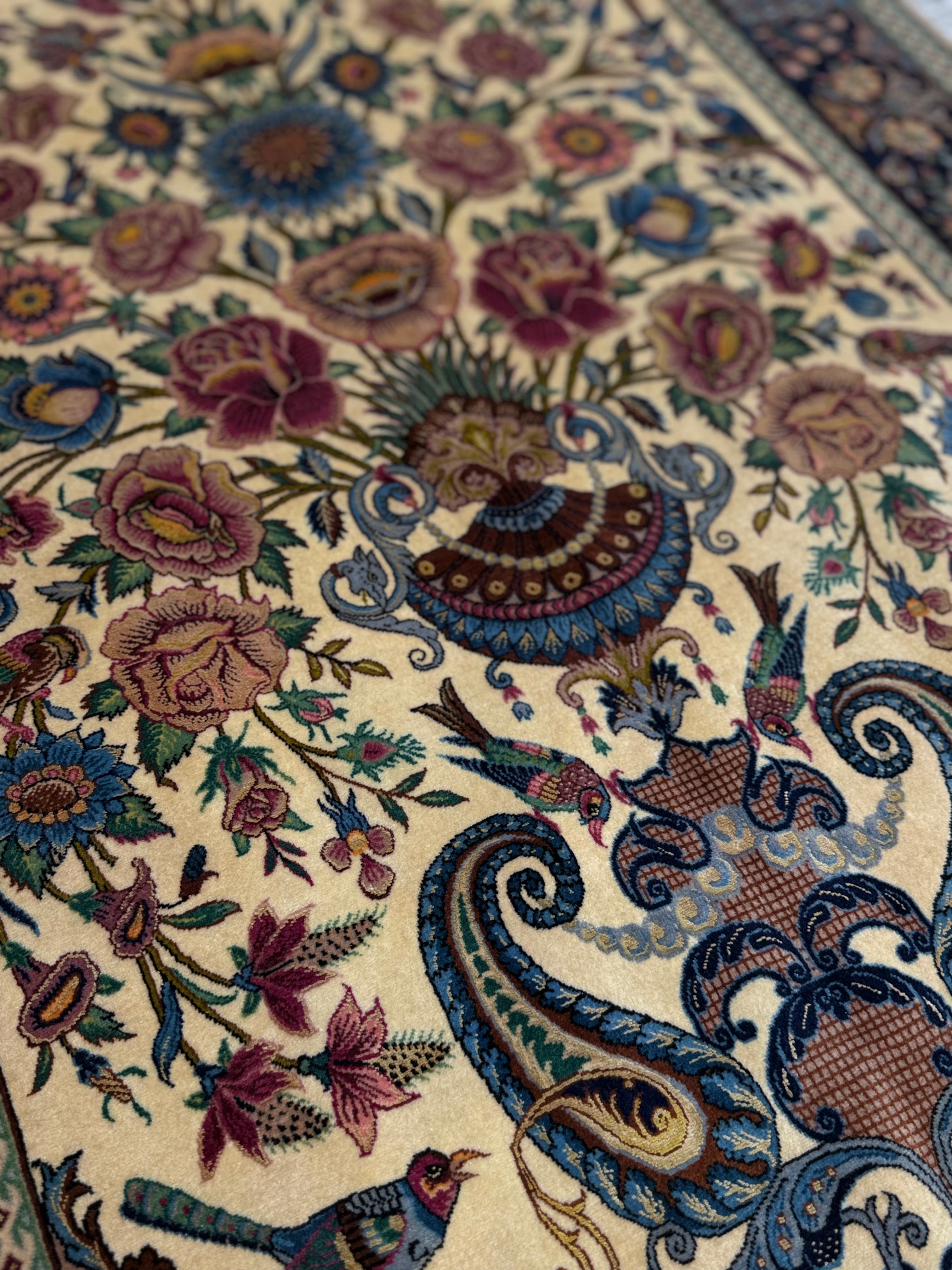 Close-up of a intricately designed floral and paisley patterned rug.