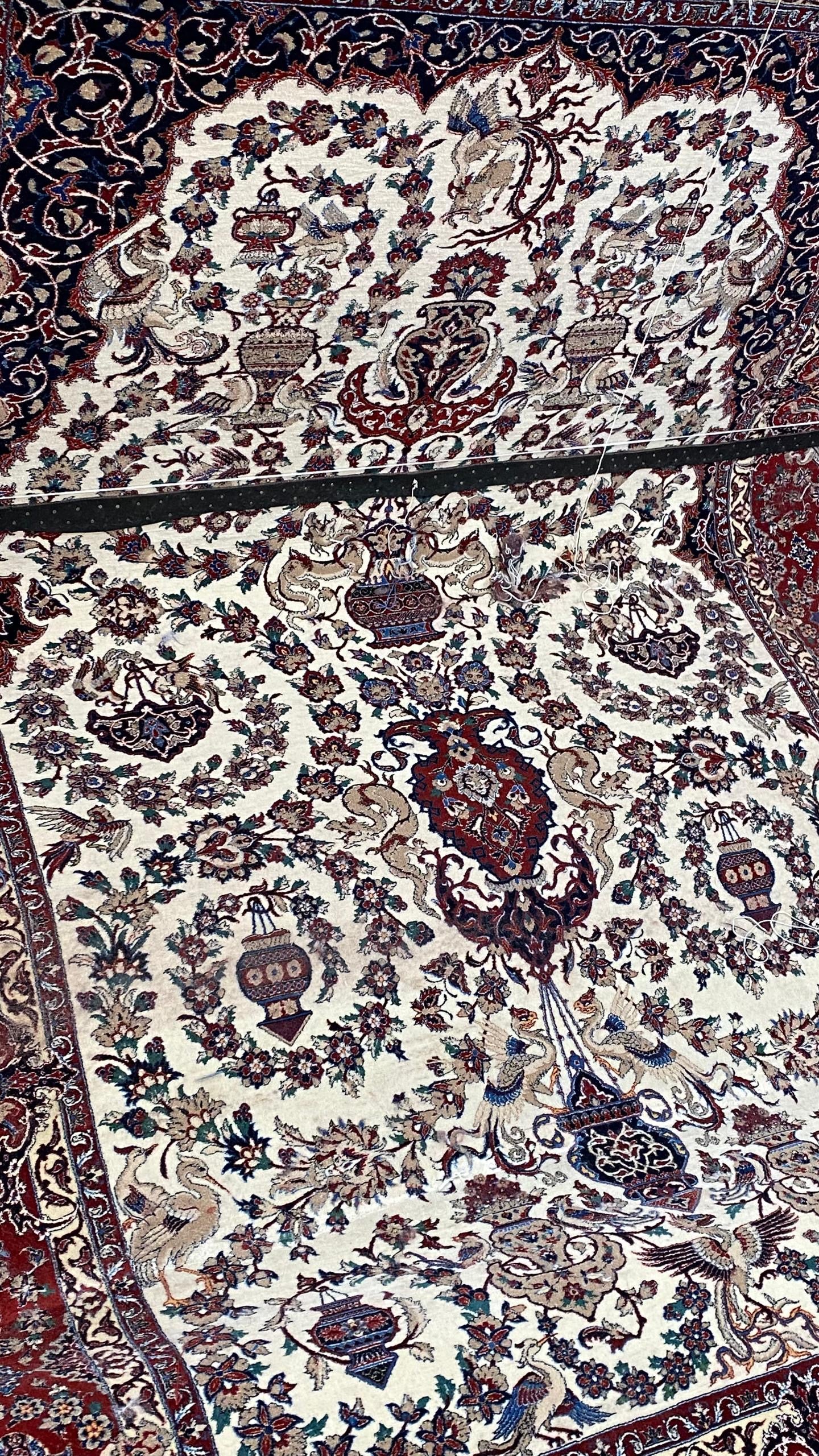 Close-up of a patterned rug with intricate designs