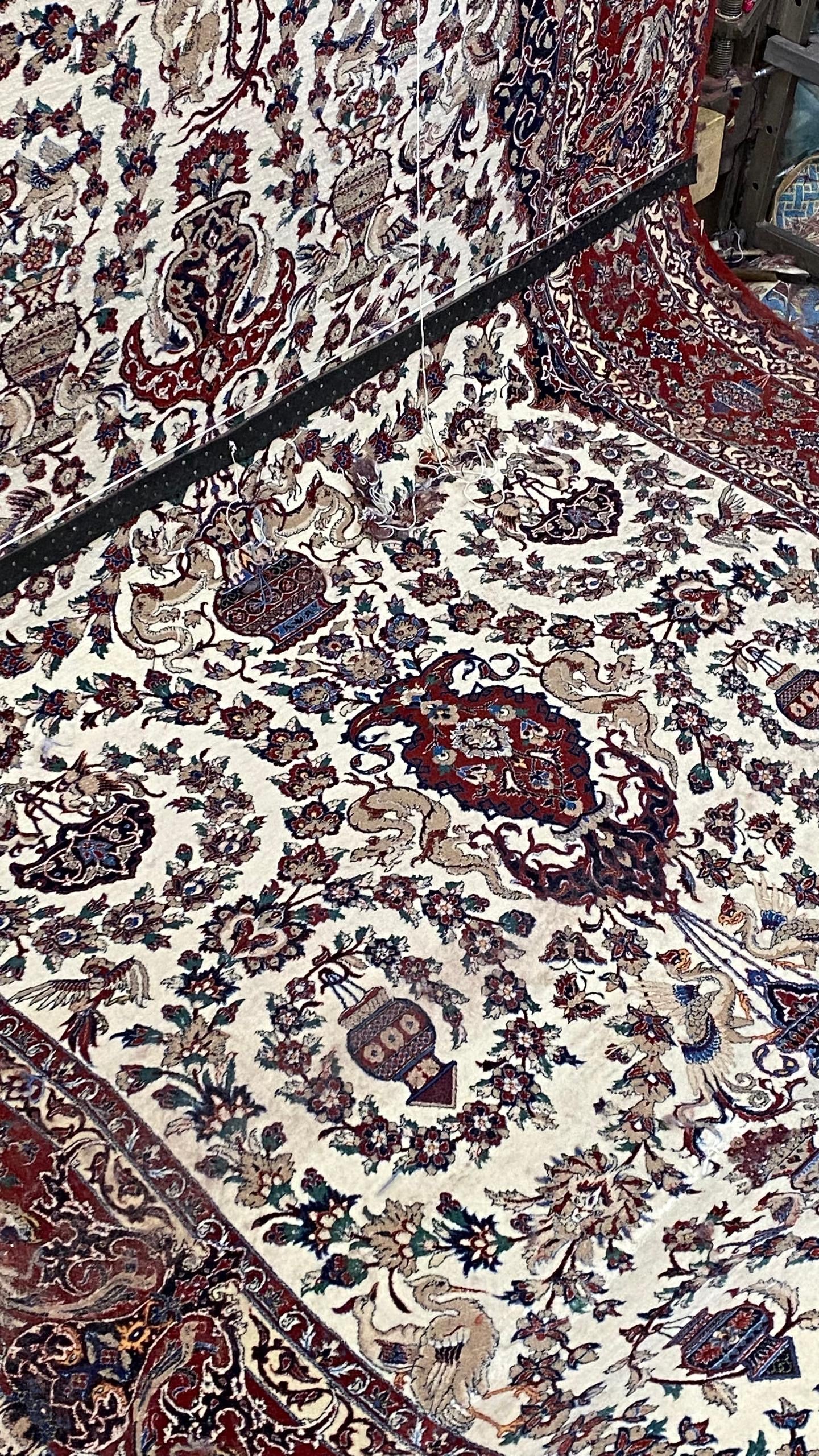Close-up of a patterned rug with intricate designs.