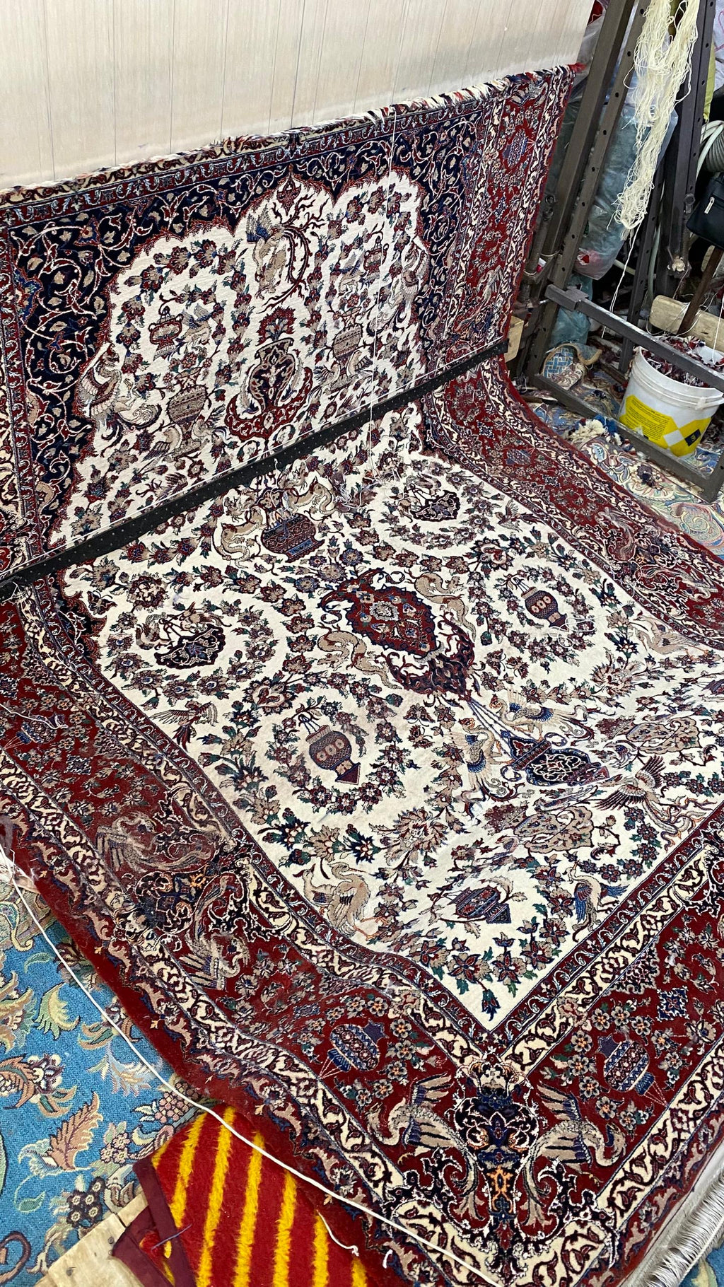 Patterned rug with intricate designs on a wooden floor.
