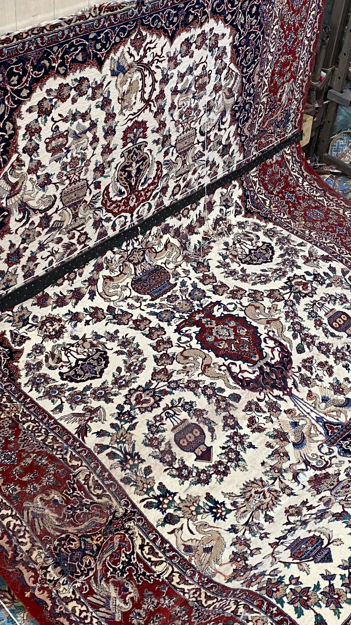 Close-up of a patterned rug with intricate designs.