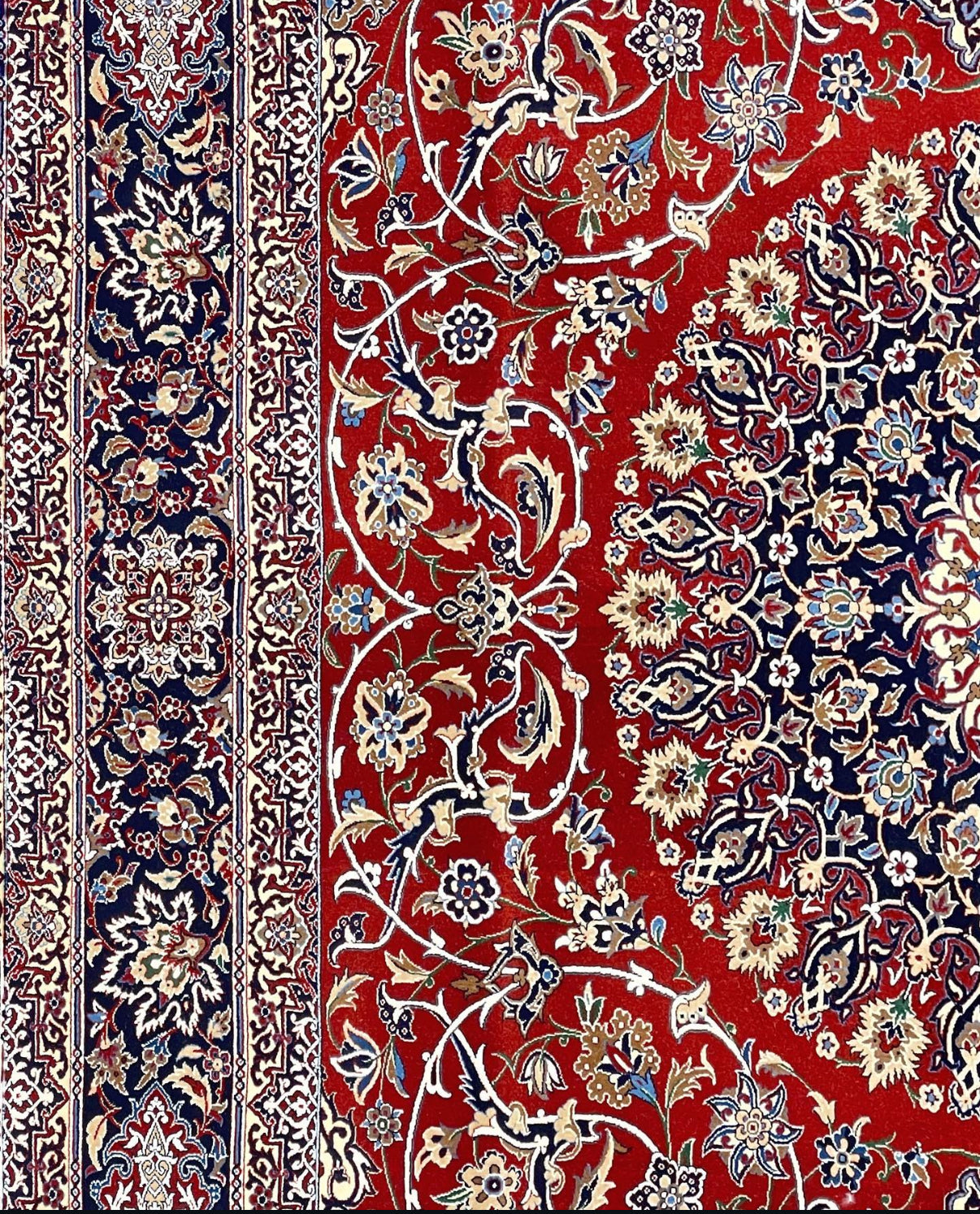 Decorative rug with intricate floral patterns on a red background