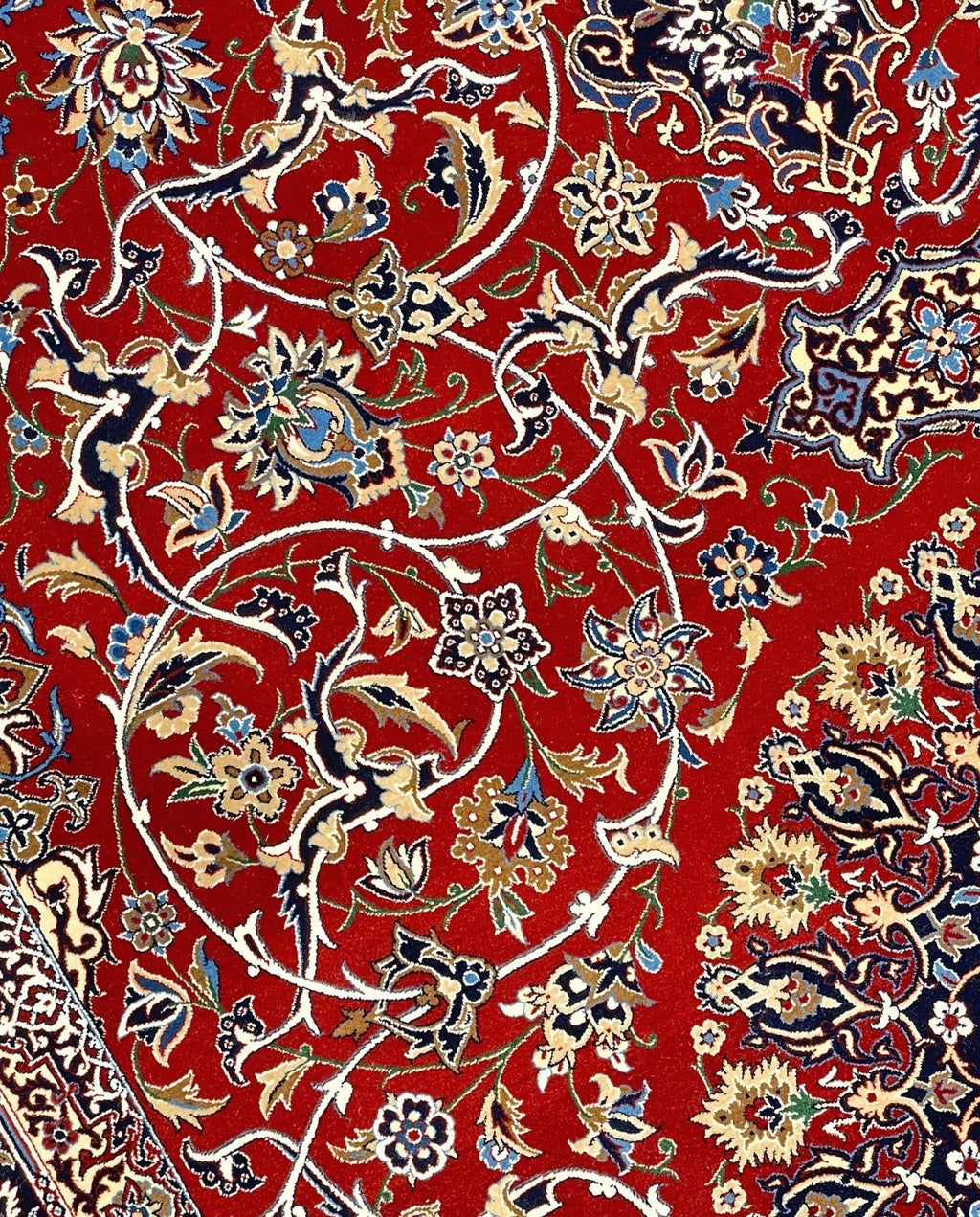 Decorative fabric with intricate floral pattern on a red background