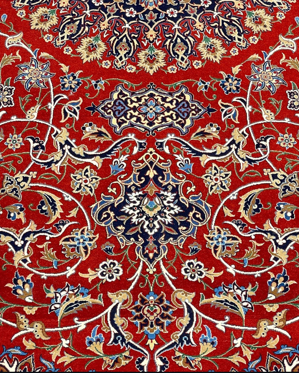 Decorative red rug with intricate patterns on a red background