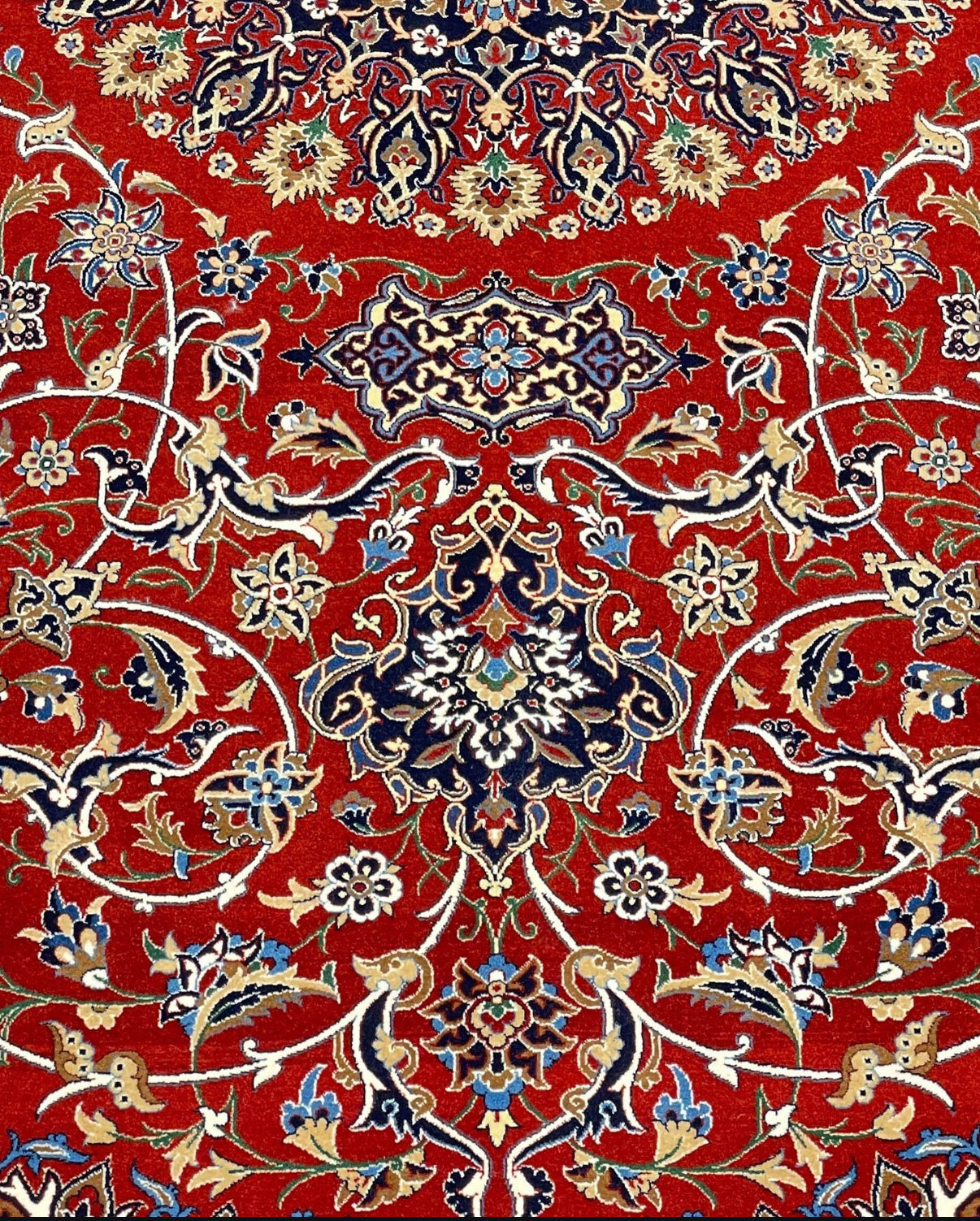 Decorative red rug with intricate patterns on a red background
