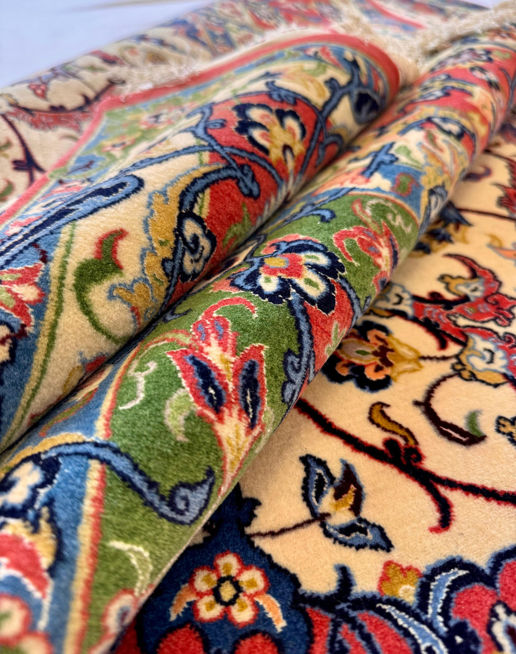 Close-up of a colorful patterned rug with intricate designs.