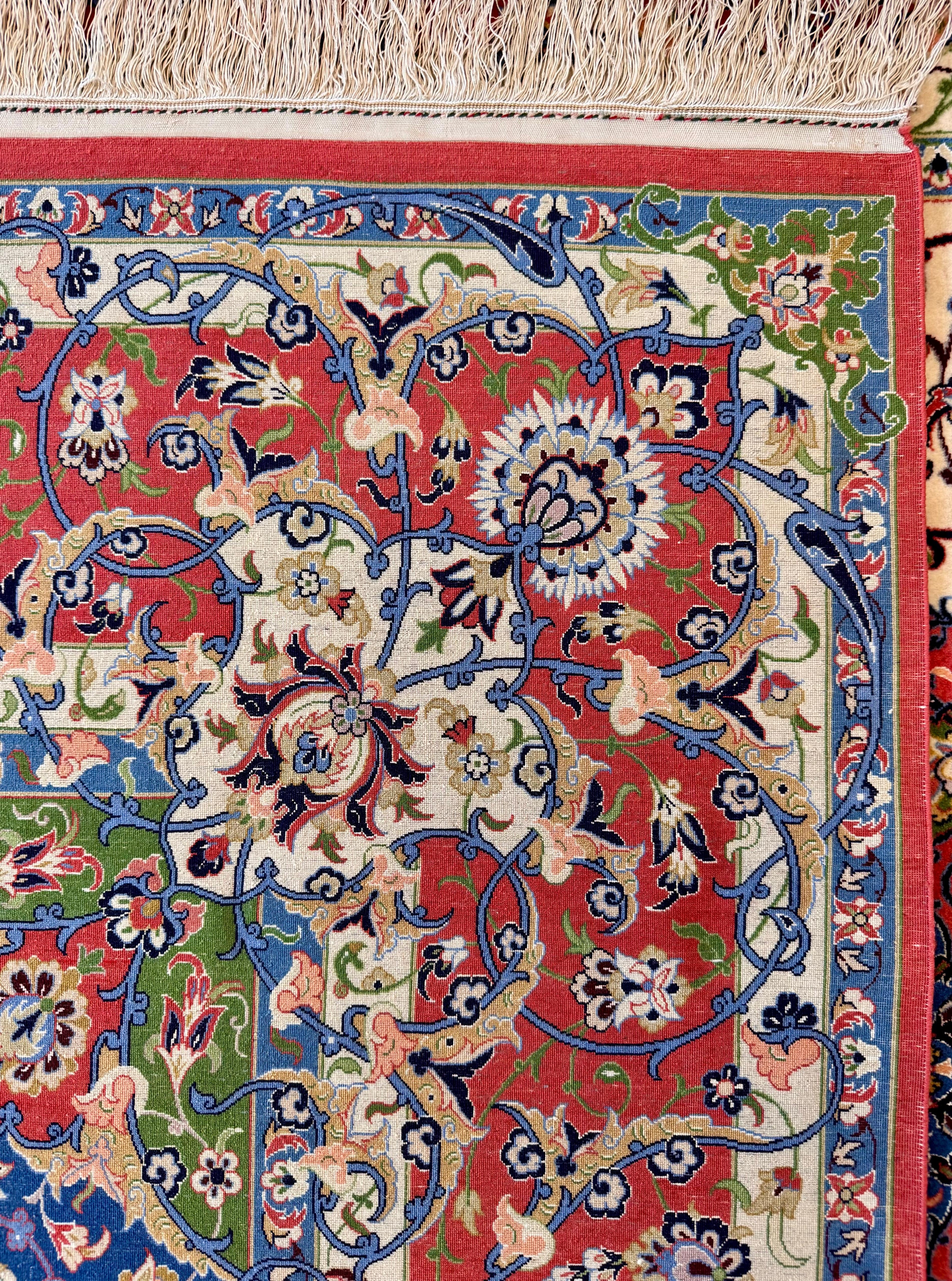 Close-up of a colorful floral patterned rug with intricate designs.