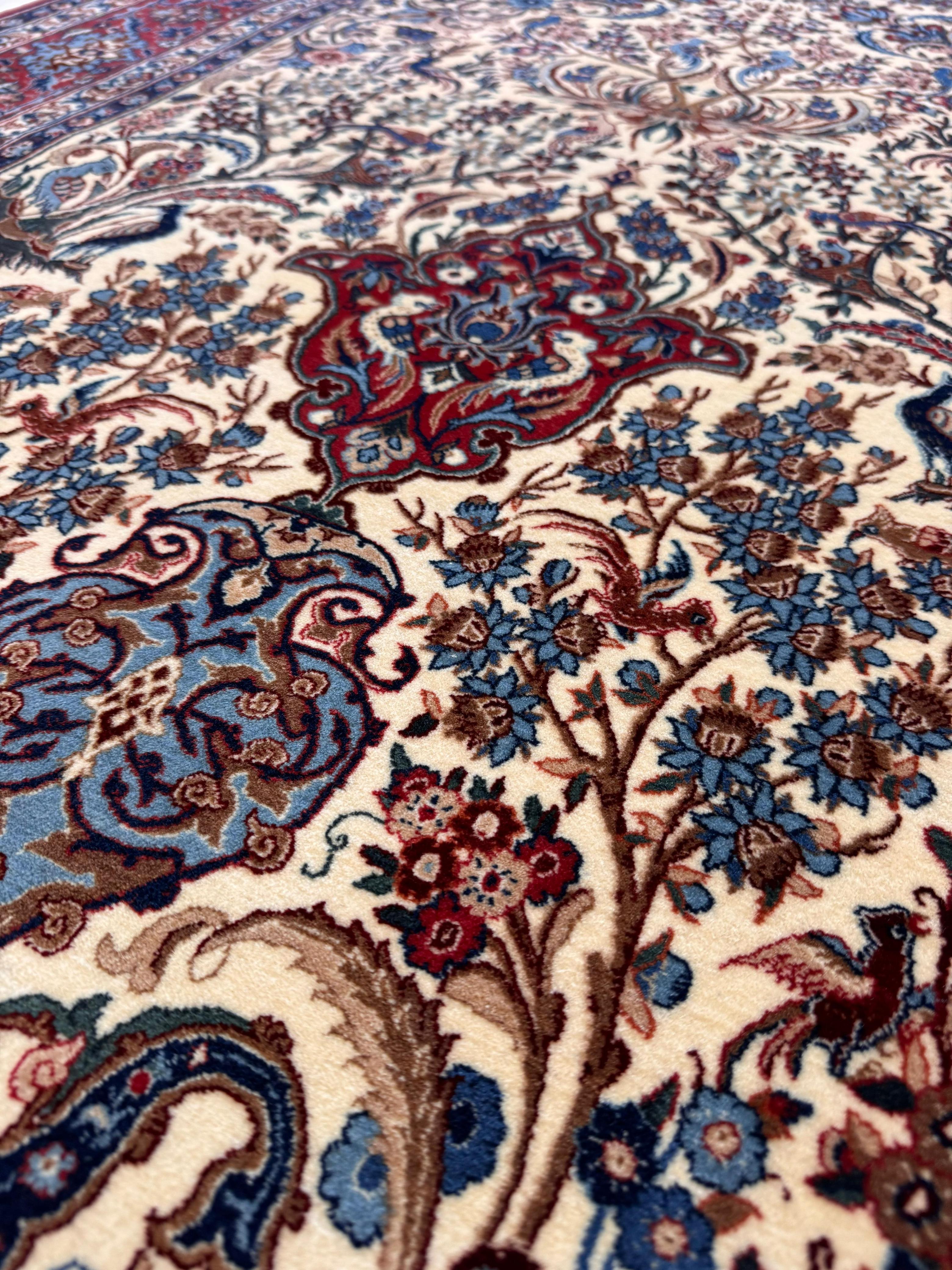 Close-up of a patterned rug with intricate designs featuring flowers and paisleys.