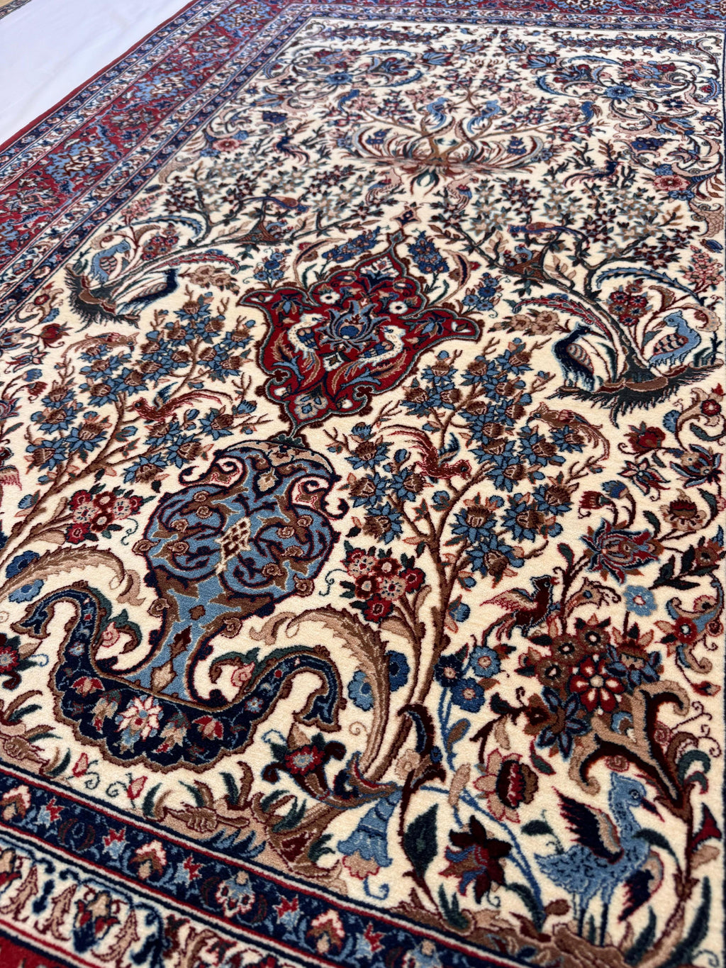 Close-up of a patterned rug with intricate designs.