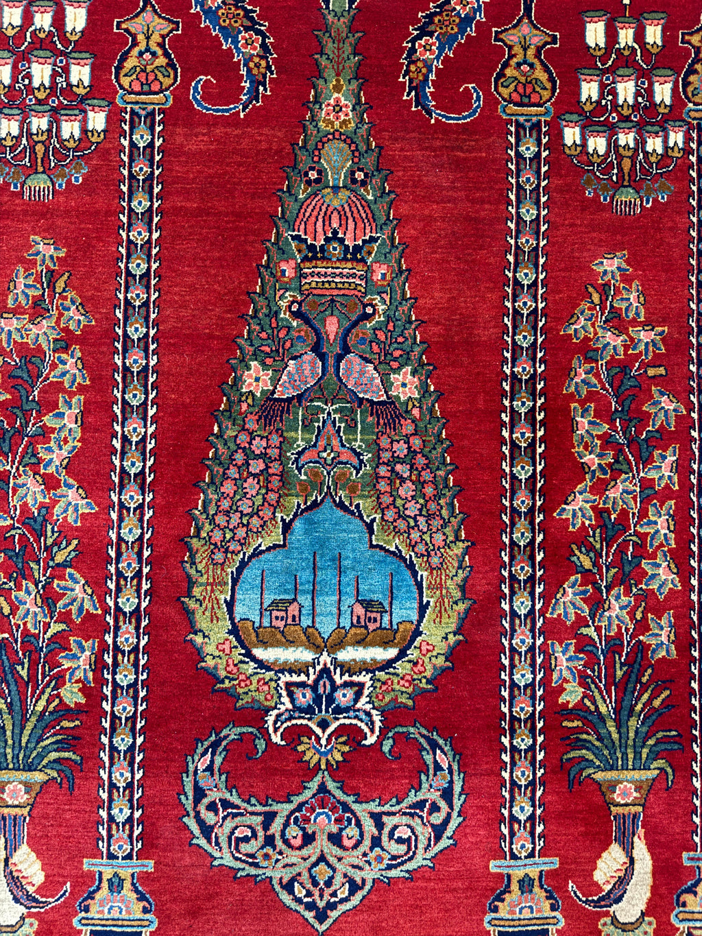 Decorative pattern on a red background with intricate designs