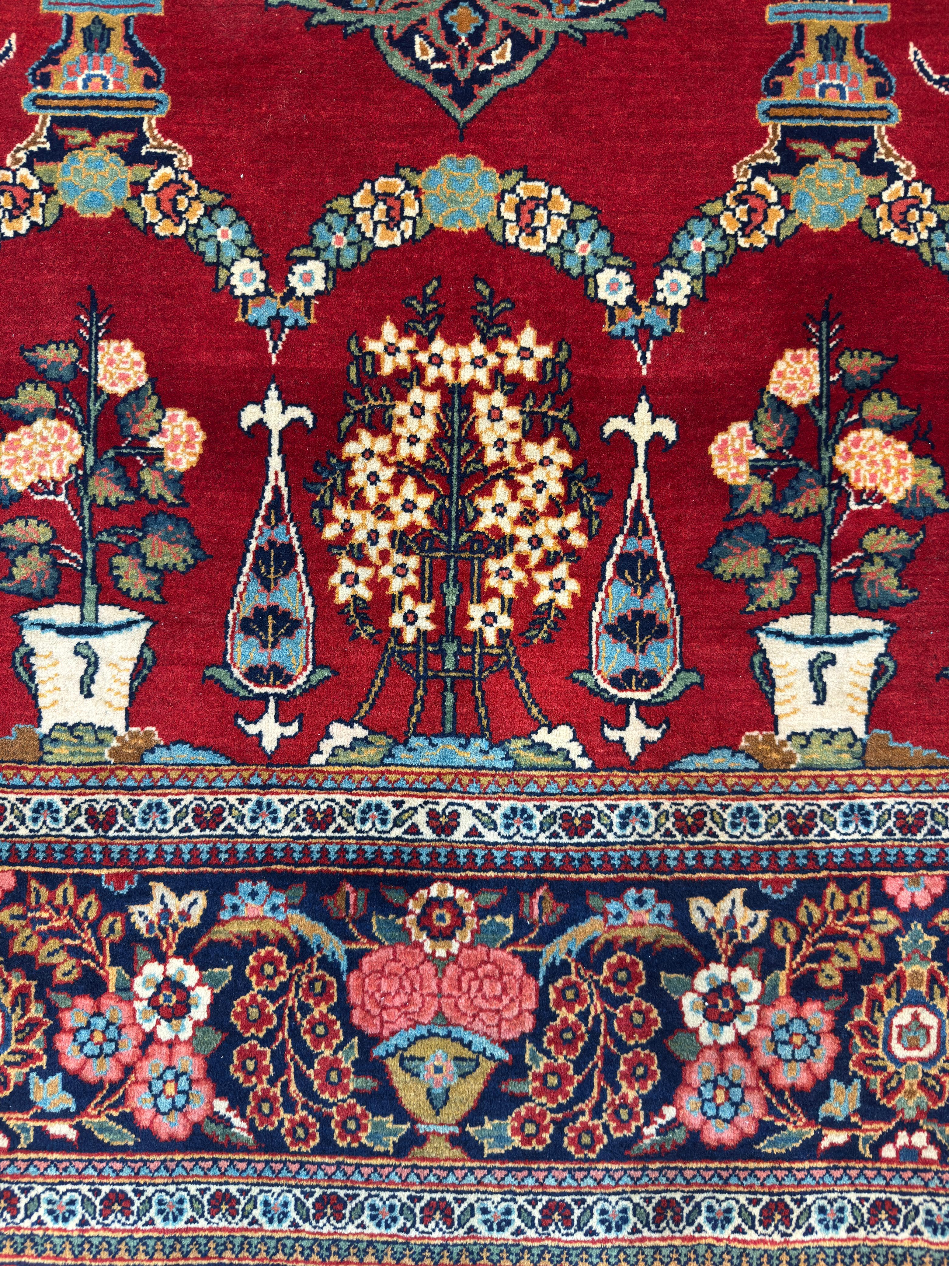 Close-up of a colorful floral and geometric patterned rug with red background