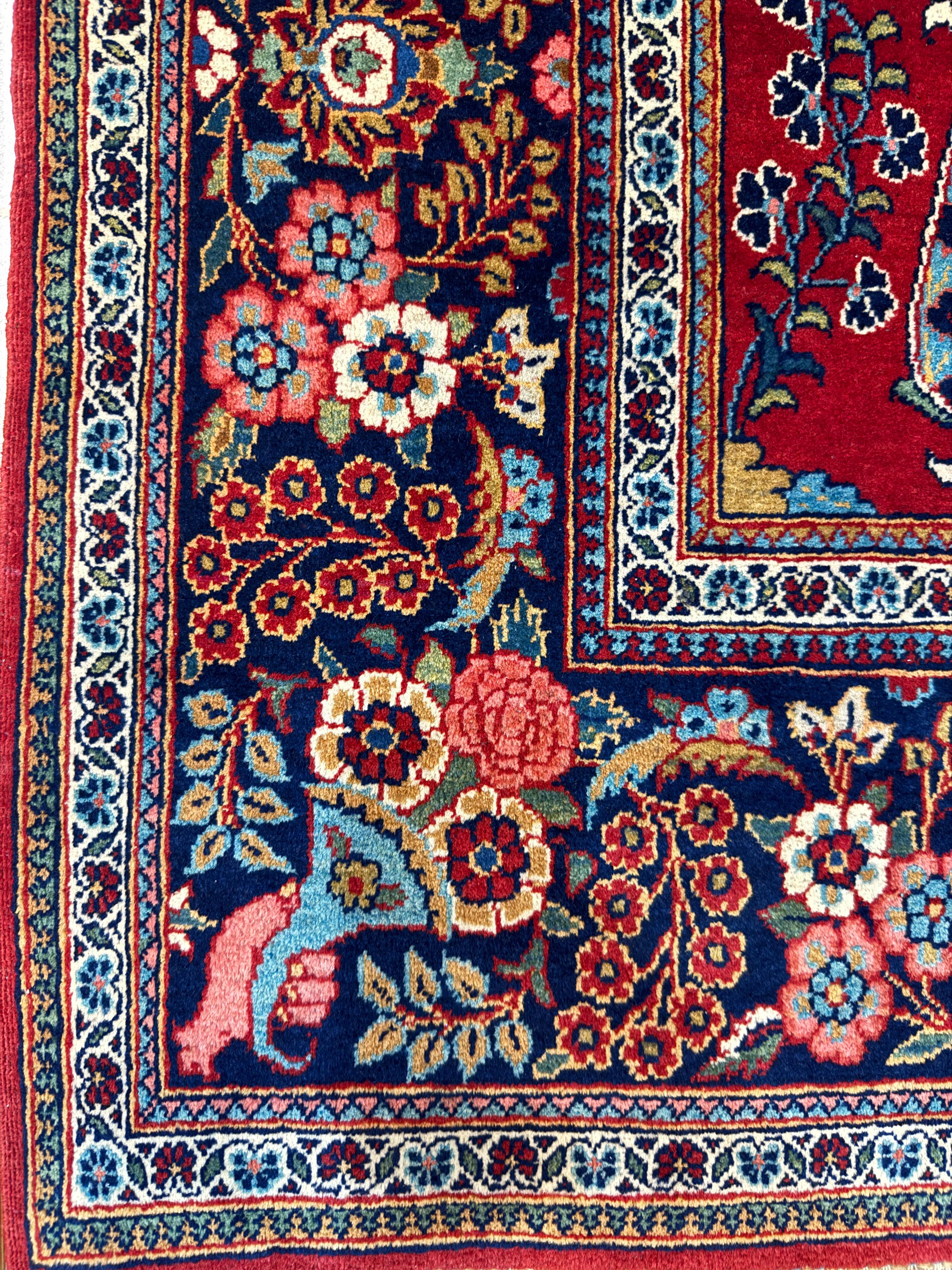 Close-up of a colorful floral-patterned rug with intricate designs.