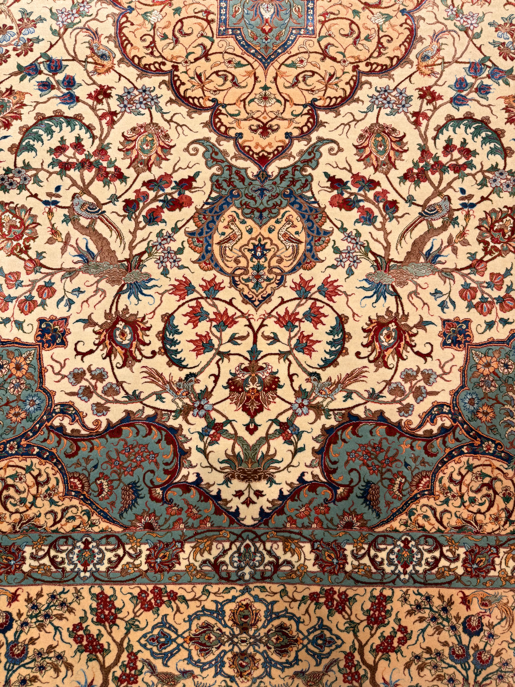 Close-up of a patterned rug with intricate designs.