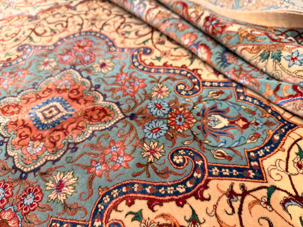 Close-up of a patterned rug with intricate designs.