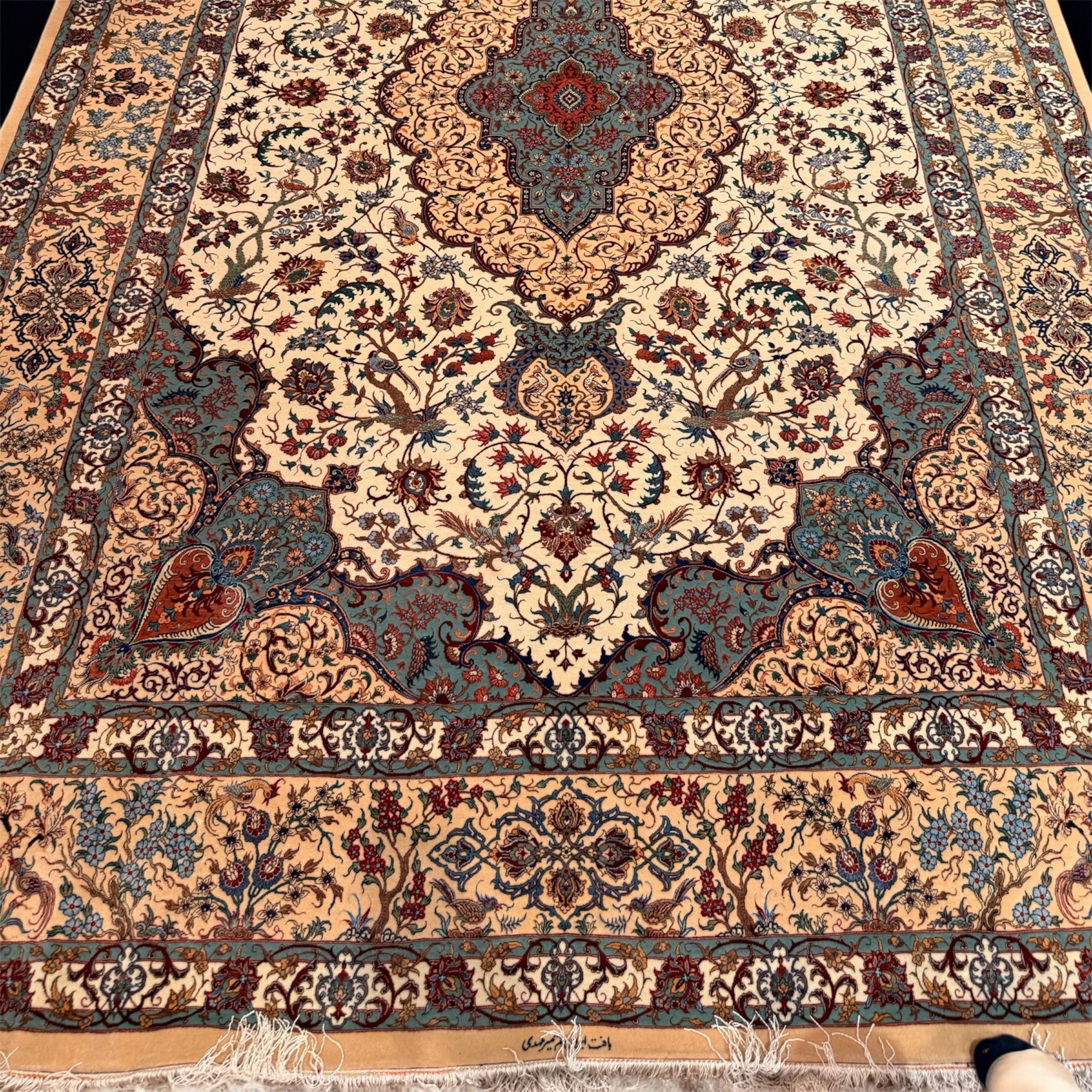 Decorative rug with intricate patterns on a wooden floor