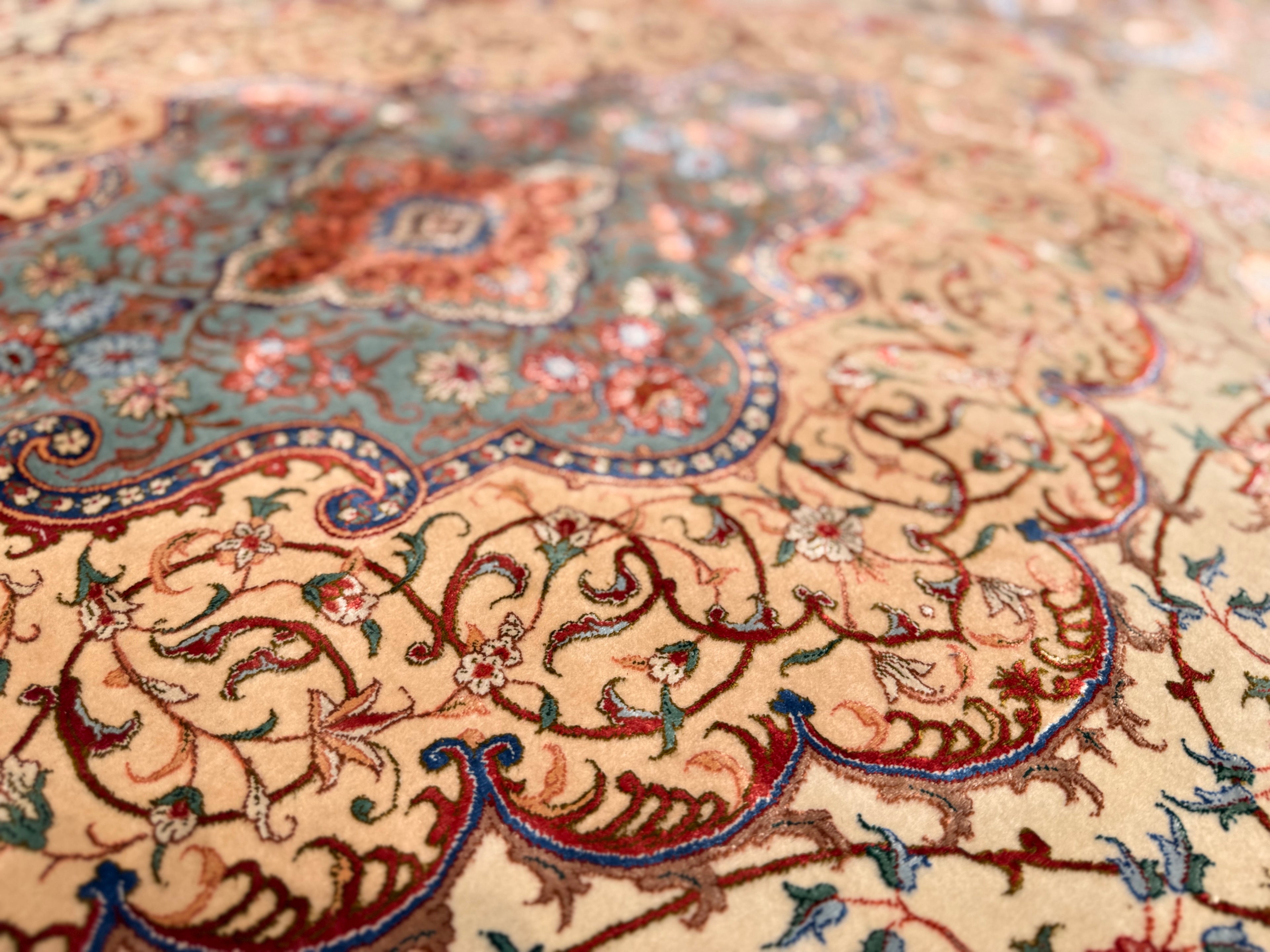 Close-up of a patterned rug with intricate designs.