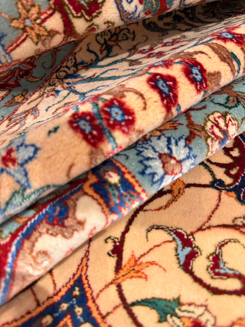 Close-up of patterned rugs with intricate designs.