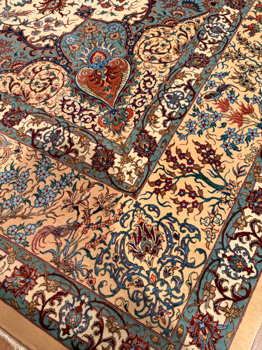Close-up of a patterned rug with intricate designs.