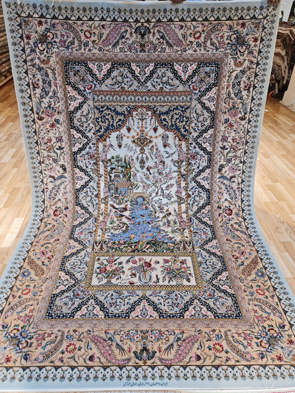 Decorative rug with intricate patterns on a wooden floor