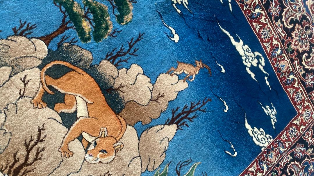 Decorative rug with a tiger design on a blue background