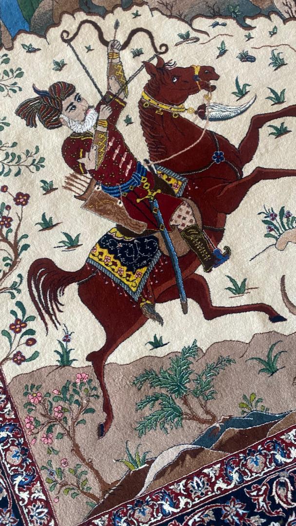 Decorative artwork of a warrior on horseback with intricate patterns and colors.